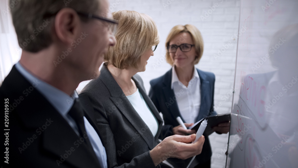 Smiling happy business woman discussing with partner plans, approves deal Smiling happy business woman discussing with partner plans, approves deal