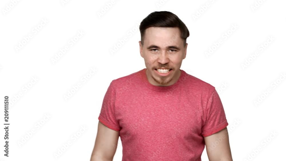 Portrait of annoyed caucasian man 30s raising hands and shouting in anger or hate, isolated over white background. Concept of emotions Portrait of annoyed caucasian man 30s raising hands and shouting in anger or hate, isolated over white background. Concept of emotions