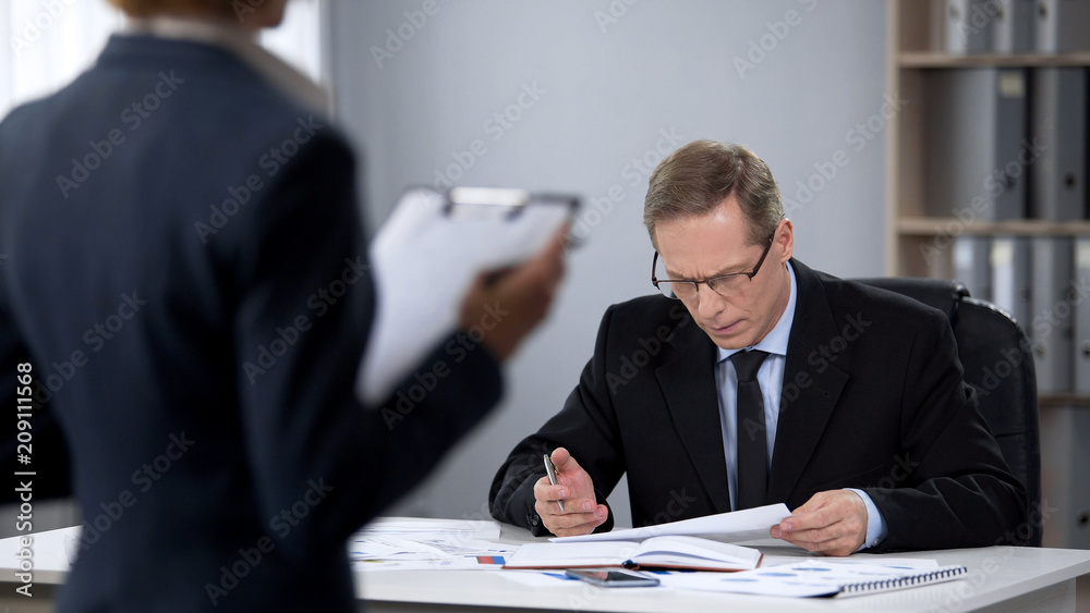 Business man worried about work of company accountant, low income, bad results Business man worried about work of company accountant, low income, bad results