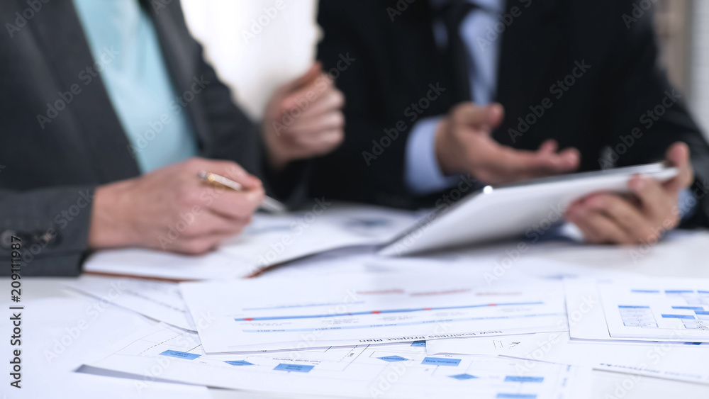 Managers checking information in tablet, online register, technology in business Managers checking information in tablet, online register, technology in business
