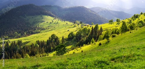 Mountain valley during sunset. Natural panoramic landscape at the summer time