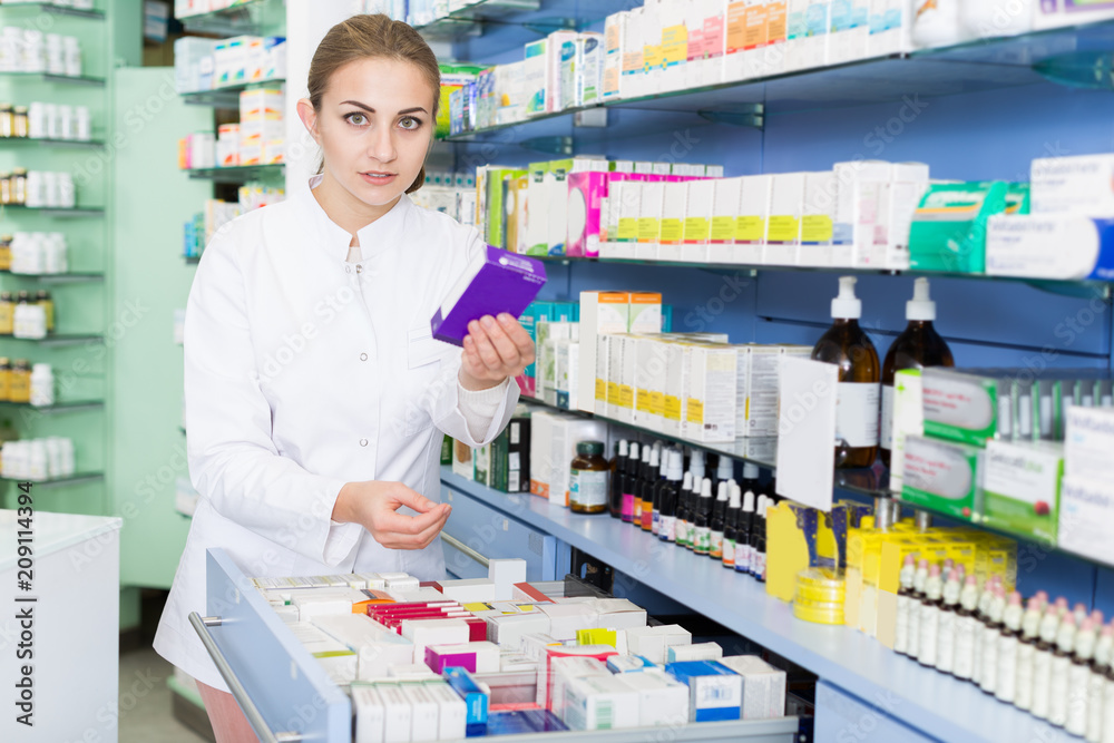  pharmacist is searching drug in drawers
