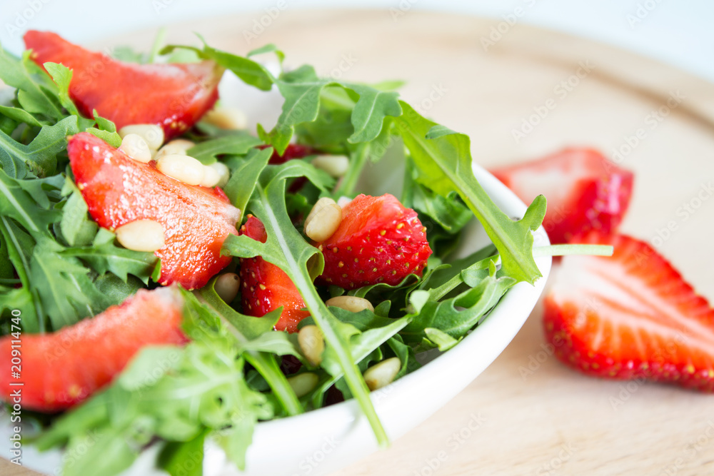 Fruit salad from arugula and strawberries. Fruit salad from arugula and strawberries.