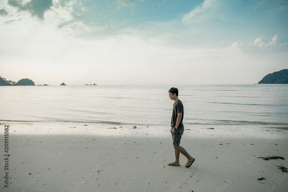 A man walking on beach