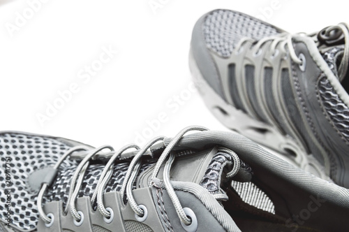 Hiking gray sneakers isolated on white background