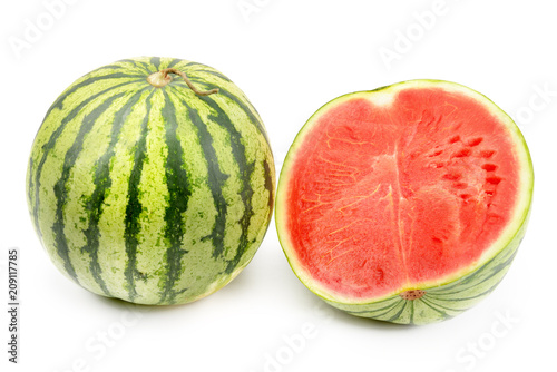 Ripe round watermelon and half berry isolated on white background.