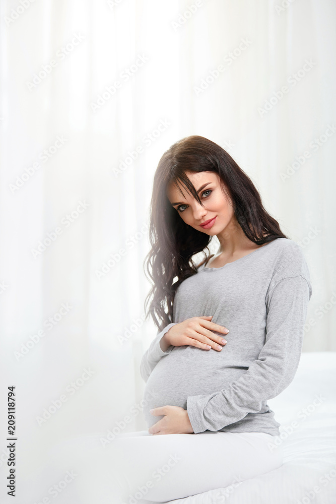 Pregnant Women. Beautiful Pregnant Woman With Belly Indoors Pregnant Women. Beautiful Pregnant Woman With Belly Indoors