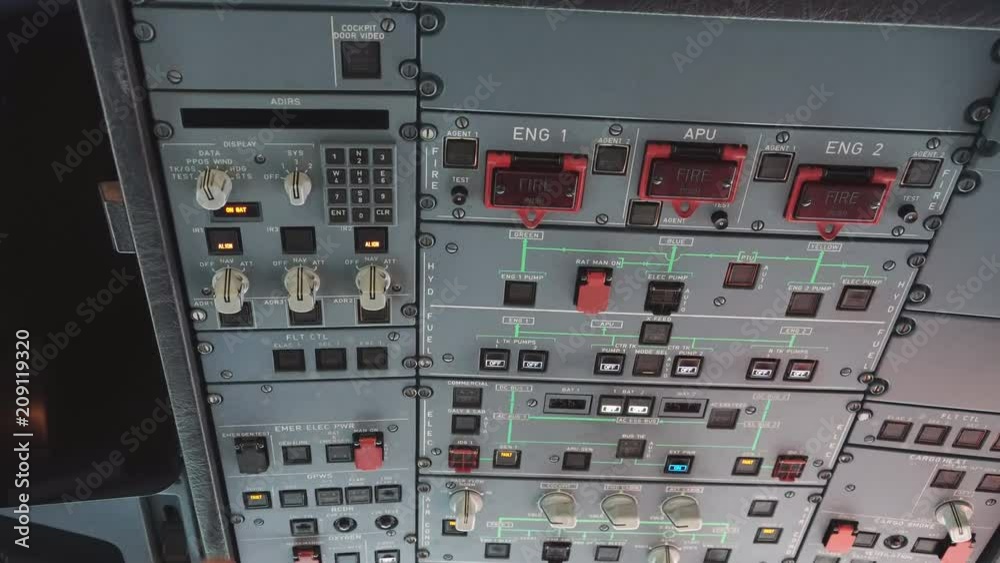 The cockpit of the aircraft. The pilot checks the electronics of the aircraft. Preparation of a passenger airliner for takeoff. The pilot checks the plane for flight. 4k The cockpit of the aircraft. The pilot checks the electronics of the aircraft. Preparation of a passenger airliner for takeoff. The pilot checks the plane for flight. 4k