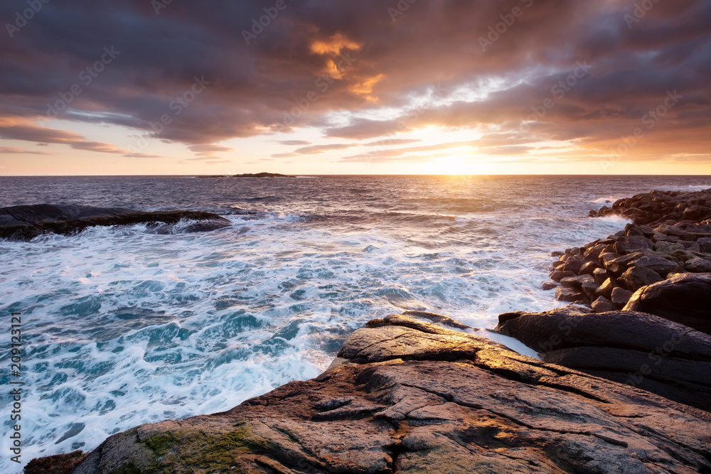 Obraz premium Seascape during storm and sunrise. Natural seascape in the Norway