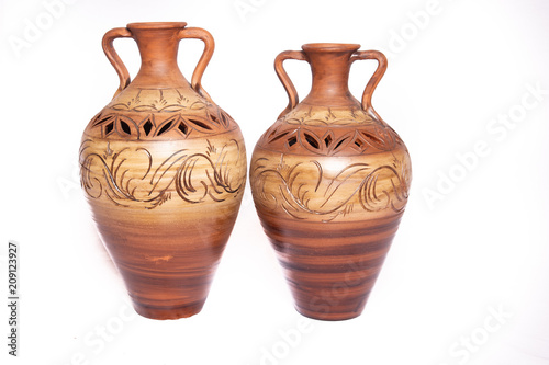 clay pitchers on white background