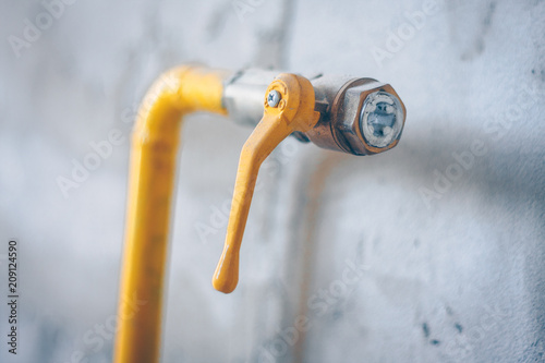 Yellow gas pipe in the house, putting the gas main into the house