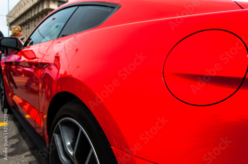 red "beast" - a powerful sports car. muscle car-side view. specific.