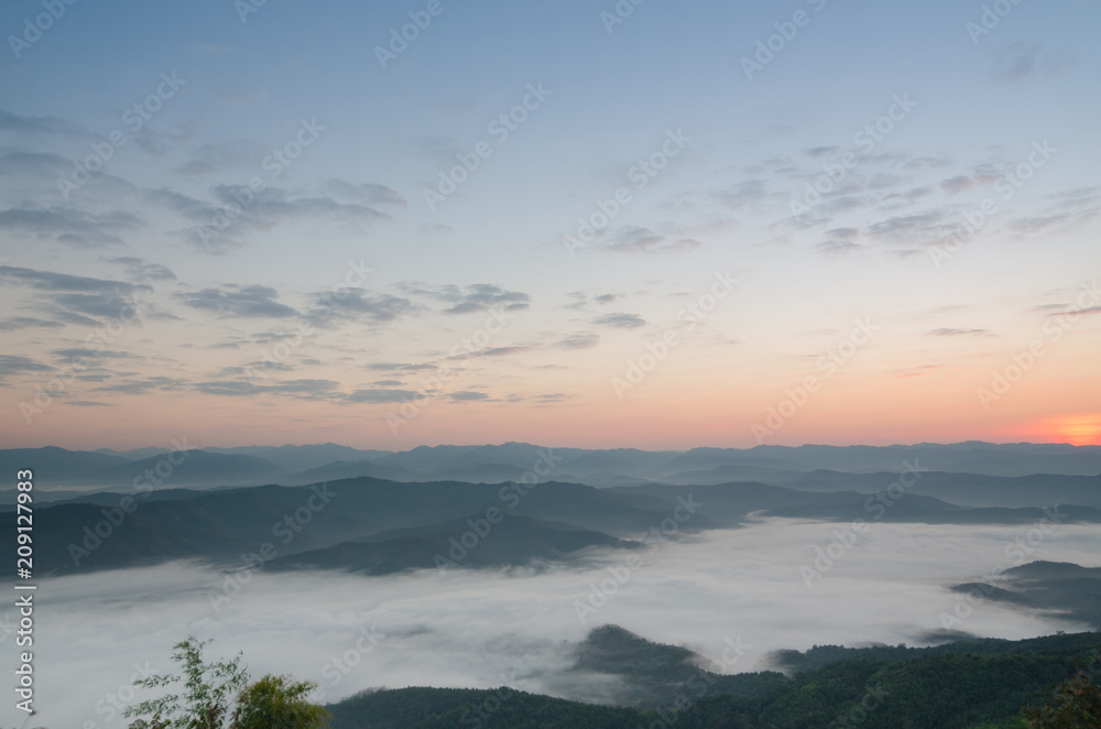 Sunset over mountains and fog. Start the first day of Easter day