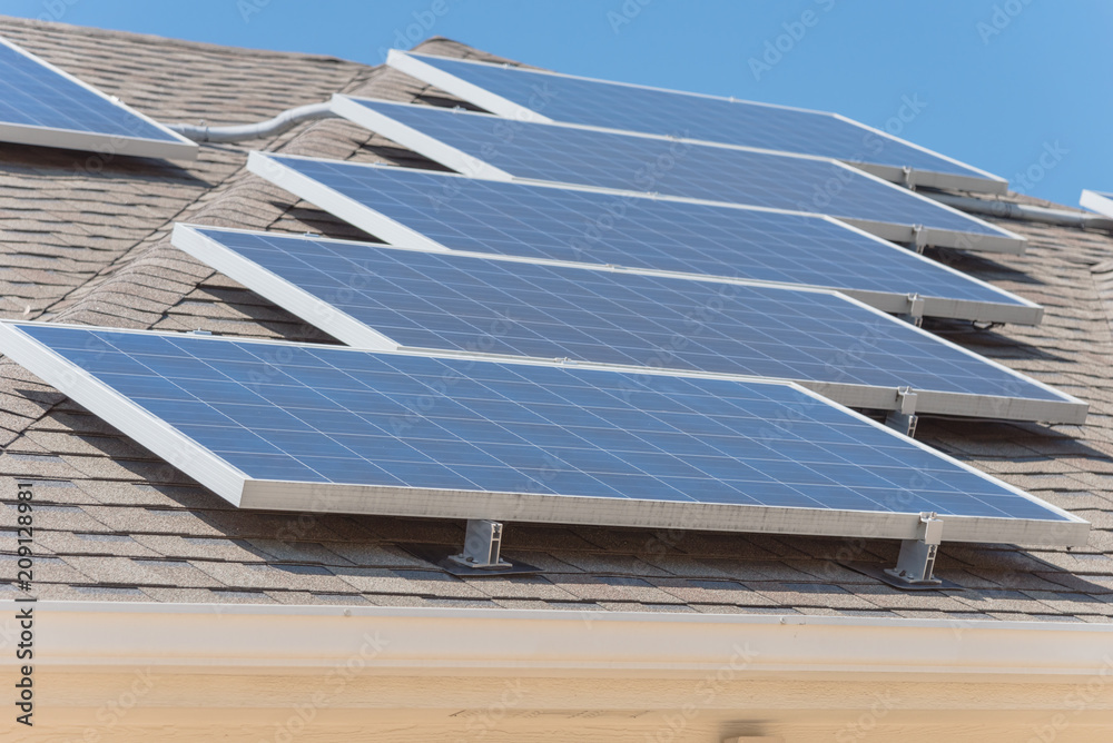 Close-up rail-less racking solar panel system on asphalt shingles ...