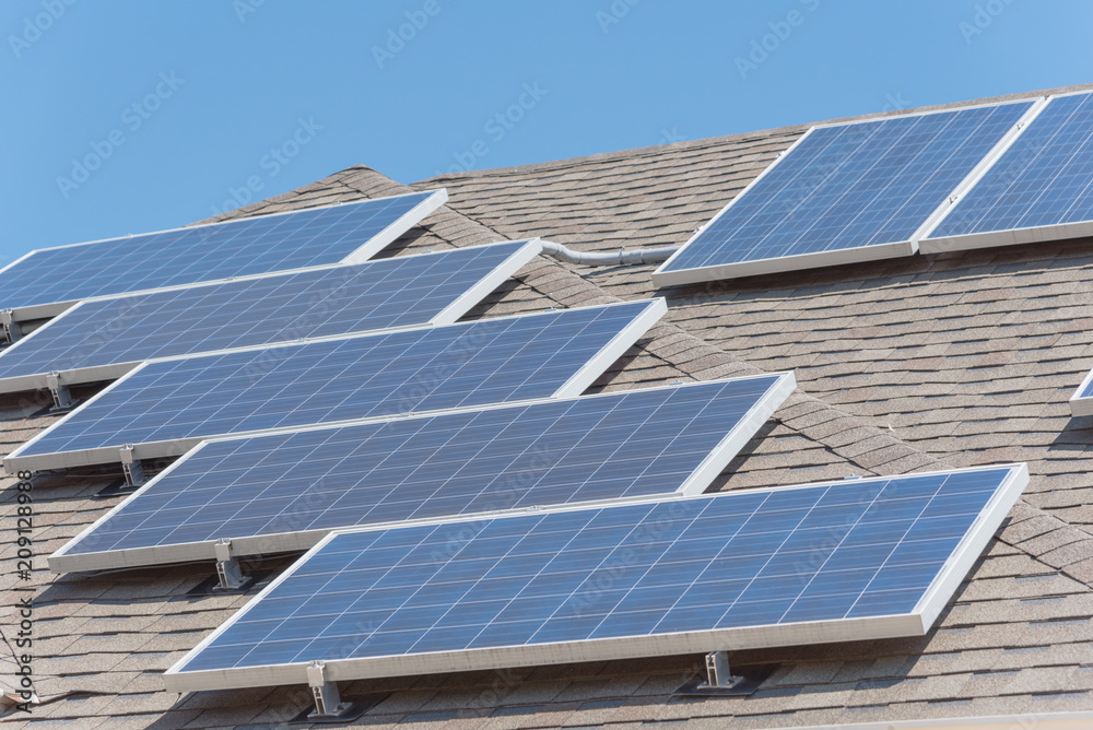 Close-up rail-less racking solar panel system on asphalt shingles ...