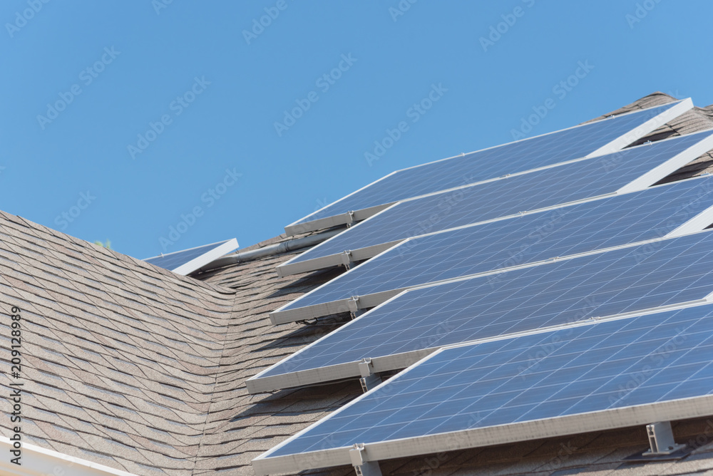 Close-up rail-less racking solar panel system on asphalt shingles ...