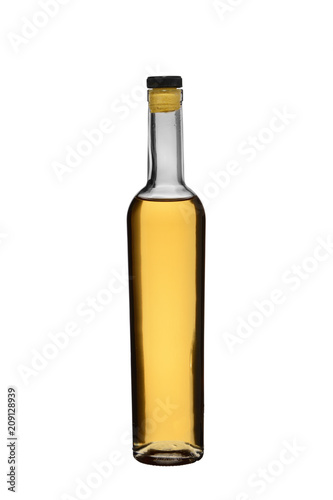 the glass bottle filled with strong alcoholic drink of whisky or brandy
