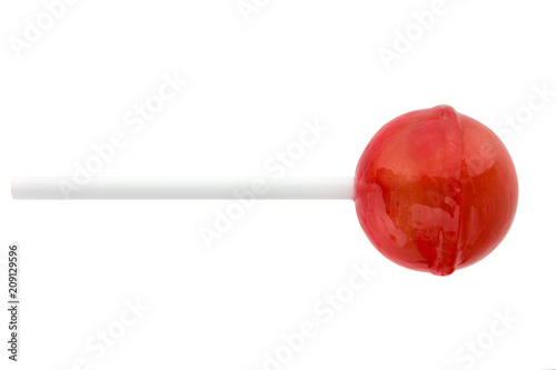 Lollipop on a stick on a white background. Round candy of red color on a white background.