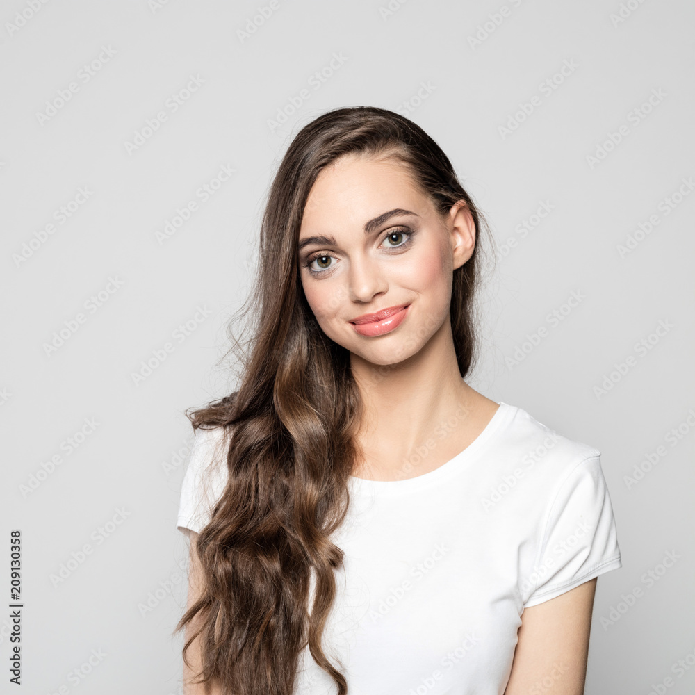Portrait of cute young woman with long hair