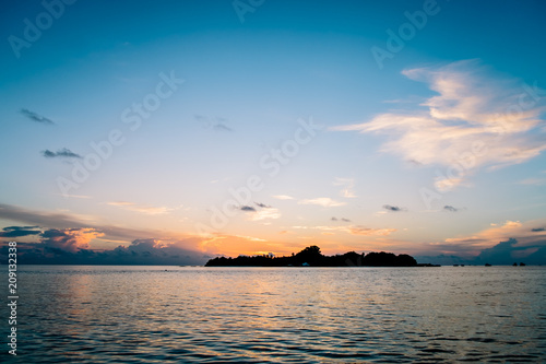 Fototapeta Naklejka Na Ścianę i Meble -  Amazing tropical landscape view. Colorful sky and clouds view with calm sea and relaxing tropical mood. Gorgeous nature background. Maldives, Indian Ocean.