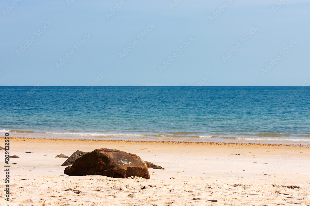 Fototapeta premium Stone on tropical sand beach on island