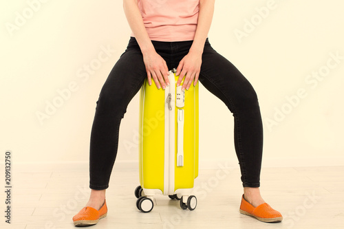 Fotografija girl with yellow suitcase isolated on white background