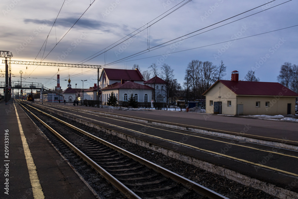 Sunset at the railway station at the Russian countryside.
