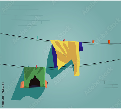 Clothes on the wall on the street. Pile