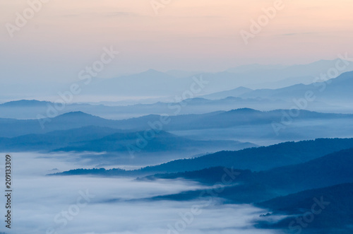 Sunset over mountains and fog. Start the first day of Easter day