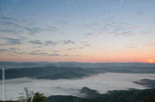 Sunset over mountains and fog