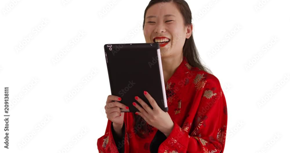 Close up of cute millennial woman video chatting using tablet computer on white background, Young female millennial having video chat with portable tablet device for copy space, 4k Close up of cute millennial woman video chatting using tablet computer on white background, Young female millennial having video chat with portable tablet device for copy space, 4k