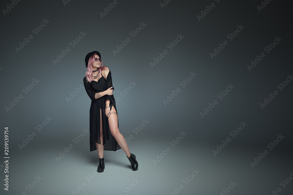 Pink hair girl with hat in black outfit smiling, looking to copy