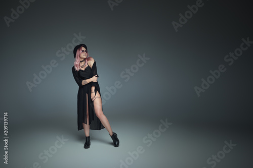 Pink hair girl with hat in black outfit smiling, looking to copy