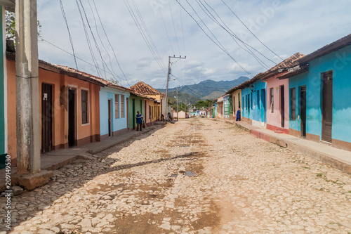 TRINIDAD, CUBA - FEB 8, 2016: View of a cobbled street in the center of Trinidad, Cuba.