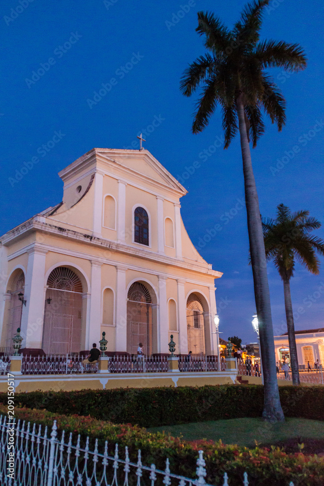 TRINIDAD, CUBA - FEB 8, 2016: Night view of Iglesia Parroquial de la Santisima Trinidad church in Trinidad, Cuba.