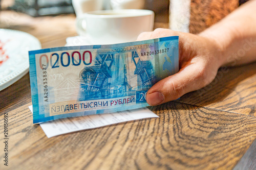 New Russian banknotes denominated in 2000 rubles to pay the bill photo