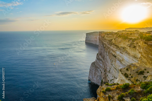 Obraz na plátně Sunset view over Ta Cenc cliffs on Gozo, Malta