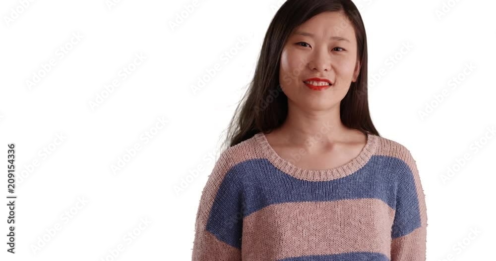 Happy millennial woman with big smile wearing a blue-striped sweater isolated on white background, Close up of young attractive Asian woman smiling for camera on copyspace, 4k Happy millennial woman with big smile wearing a blue-striped sweater isolated on white background, Close up of young attractive Asian woman smiling for camera on copyspace, 4k