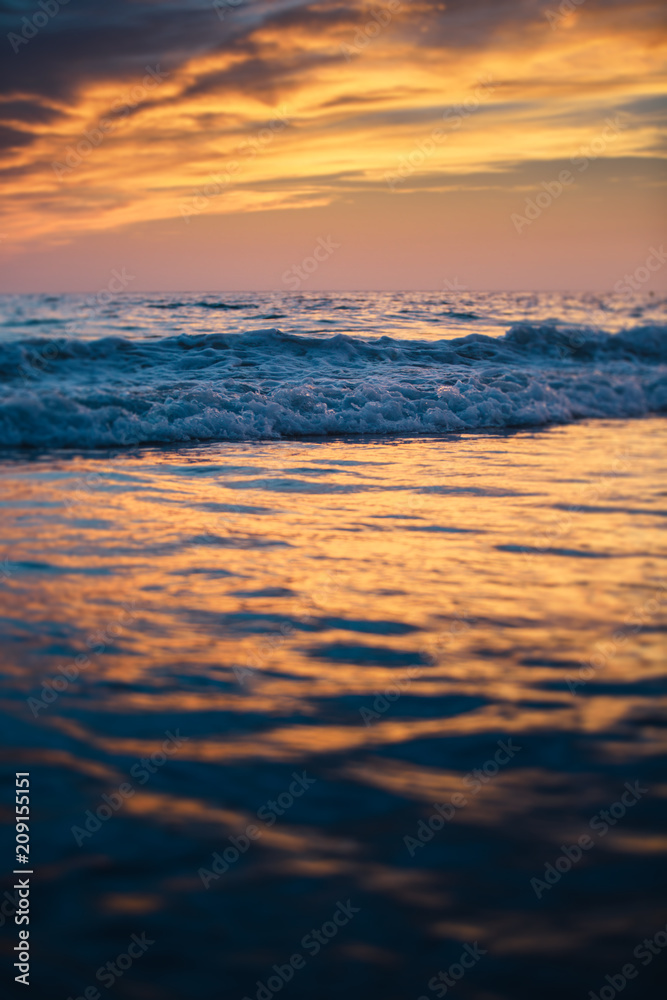 Beautiful sunset reflected on the sea waves Beautiful sunset reflected on the sea waves