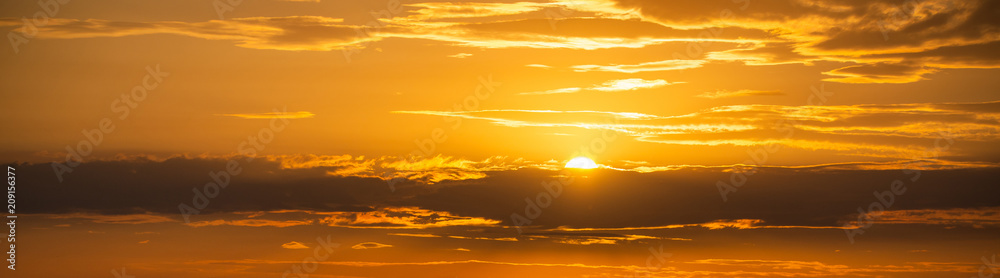 Fototapeta premium Golden color of dramatic clouds and sky on sunset