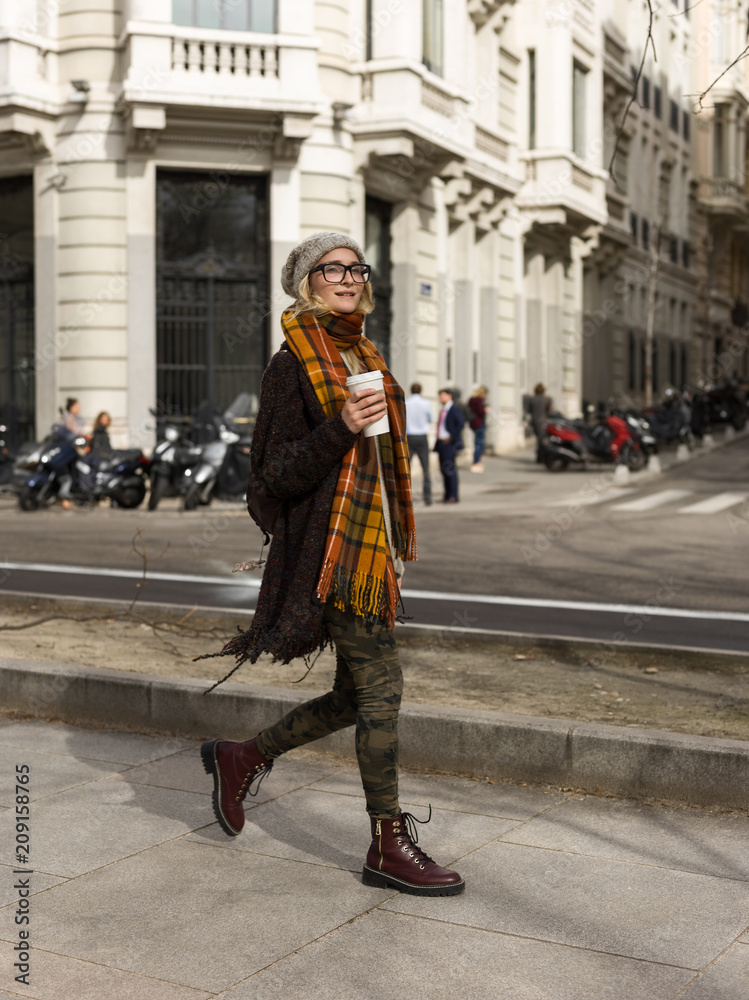 Woman on street with takeaway coffee Woman on street with takeaway coffee