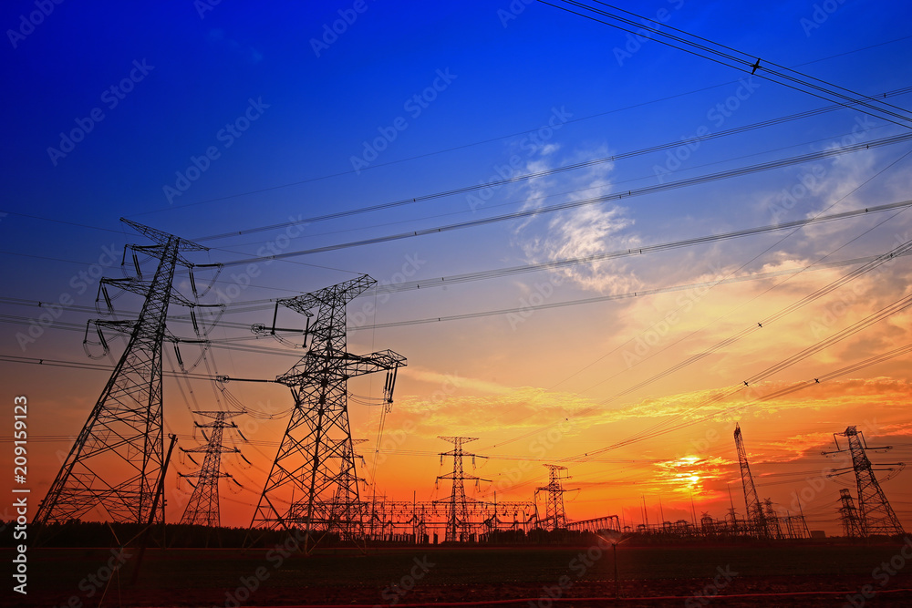 Fototapeta premium Electric tower, silhouette at sunset