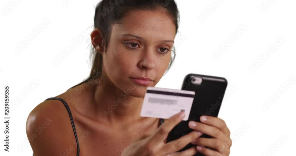 Close up of pretty Caucasian woman using mobile phone and card for easy online banking, Millennial female on white background purchasing goods from the Internet using smartphone, 4k Close up of pretty Caucasian woman using mobile phone and card for easy online banking, Millennial female on white background purchasing goods from the Internet using smartphone, 4k