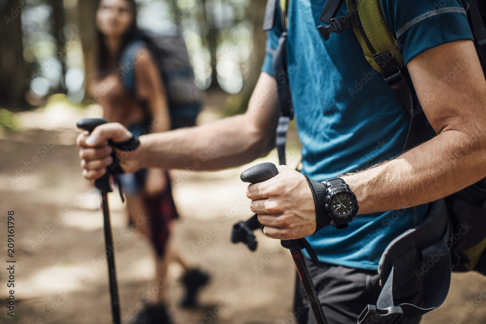 Couple Trekking in Woods Couple Trekking in Woods