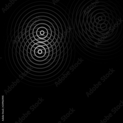 Abstract white rings sound light effect on black background