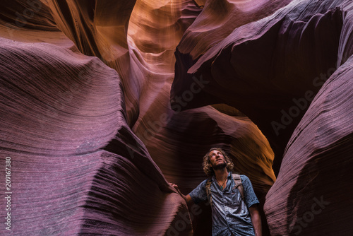 A young man admiring a slot canyon in Arizona