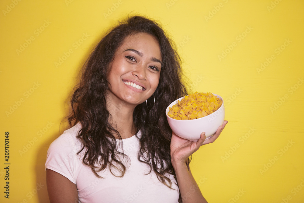 beautiful asian girl with a bowl of cereal for breakfast beautiful asian girl with a bowl of cereal for breakfast
