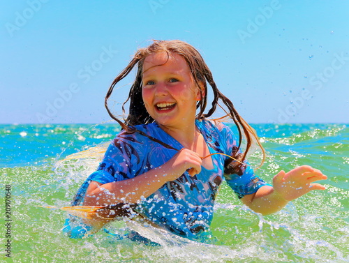  A teenage girl loves to swim in the sea.