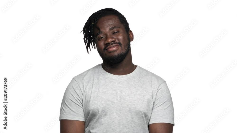 Portrait of big african american man wearing afro hairdo and mustache gesturing ok sign at camera with positive look, isolated over white background. Concept of emotions Portrait of big african american man wearing afro hairdo and mustache gesturing ok sign at camera with positive look, isolated over white background. Concept of emotions
