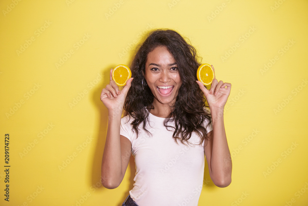expressive asian woman with slices of fresh lemon expressive asian woman with slices of fresh lemon